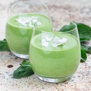 Vanilla, mint, spinach and coconut milk detox green smoothie in glass, square format