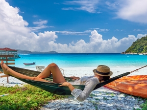 Woman in hammock on beach